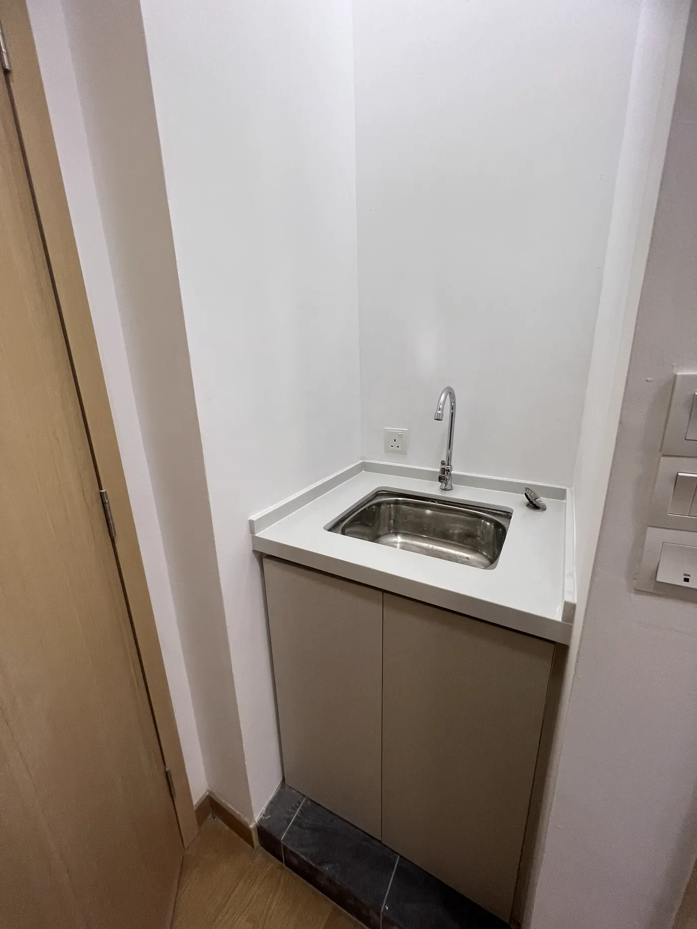 Completed sink and plumbing installation at The Luxe